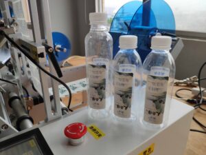 Wrap around labeling with two labels for water bottles